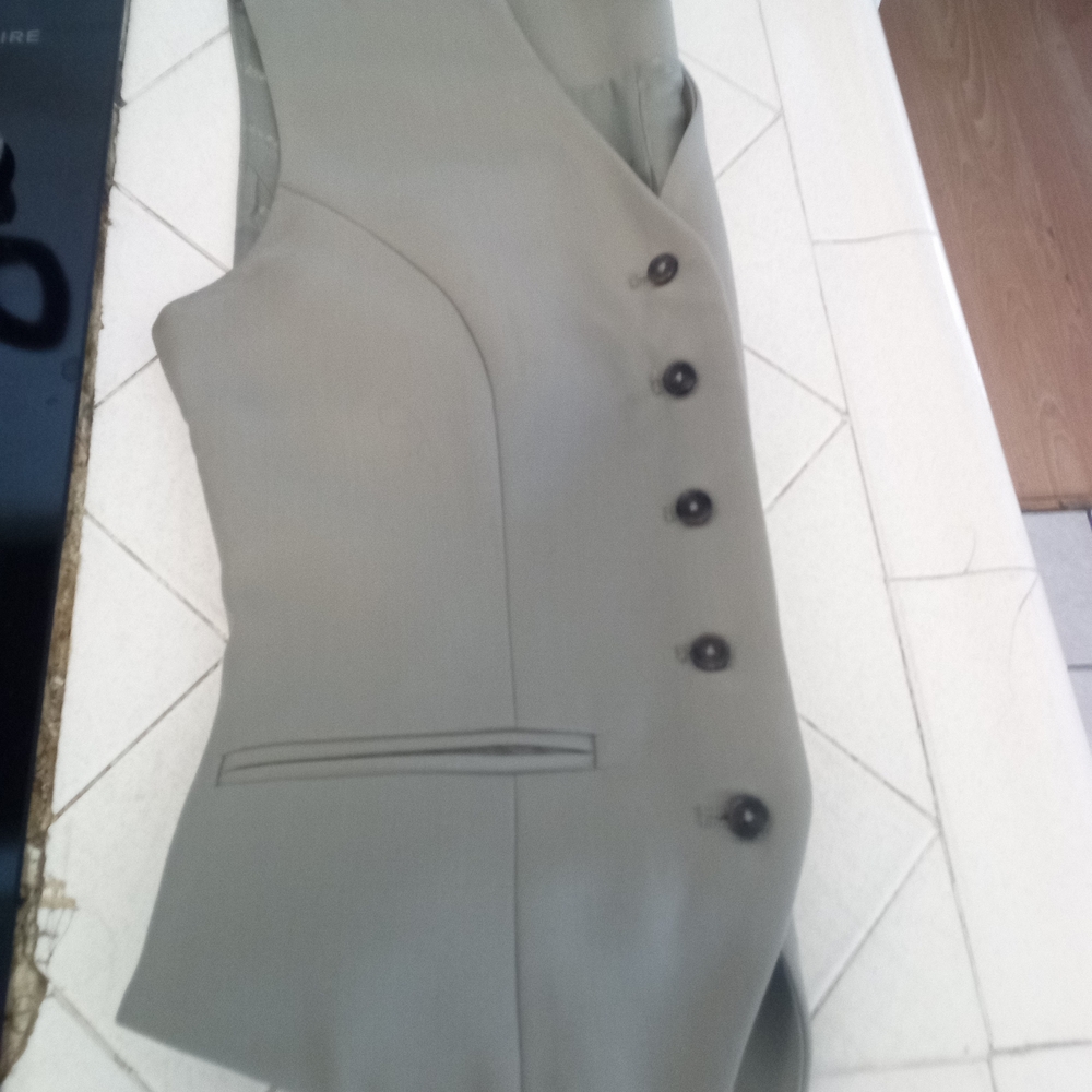 Stylish Tan Vest with Black Buttons